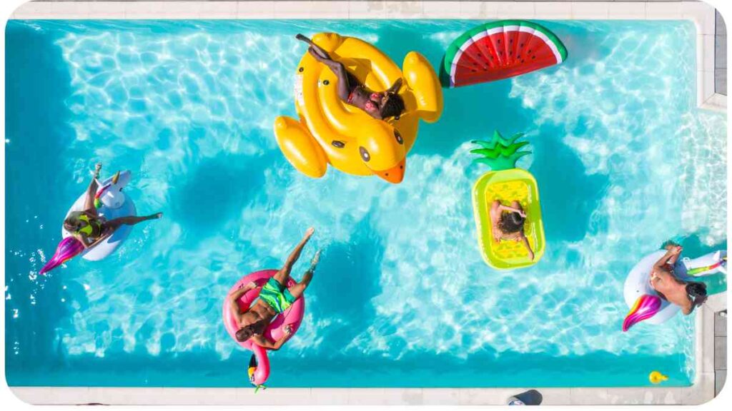 an overhead view of people floating in a swimming pool